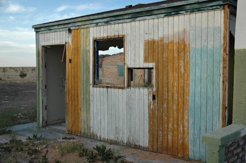 a building with a hole in the side and doors opened