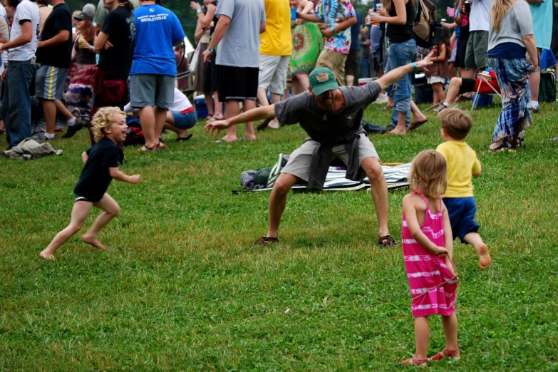 a crowd of people playing with a frisbee