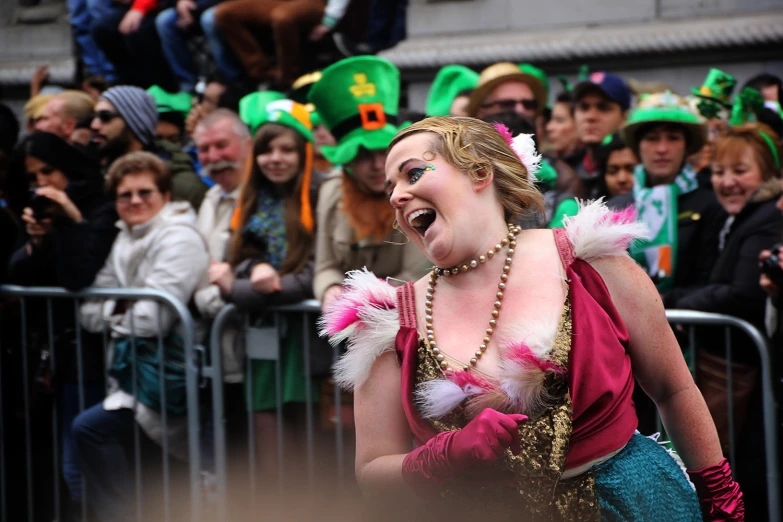 a woman dressed up in a mardi gras costume