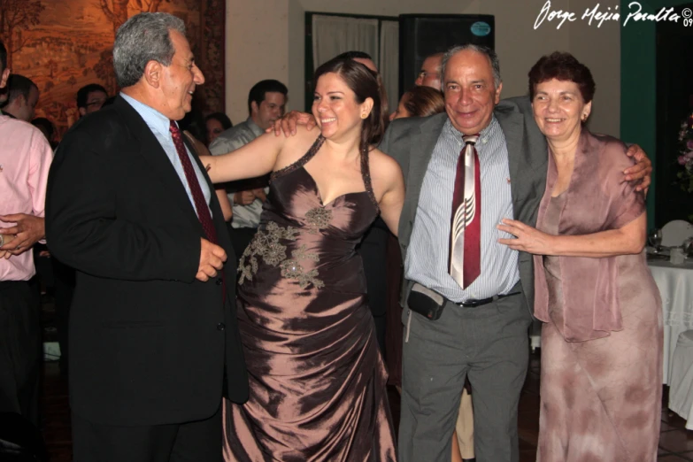 a group of older people standing around each other