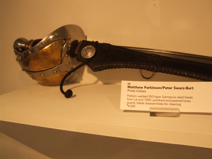 a close - up s of a metal weapon on a shelf