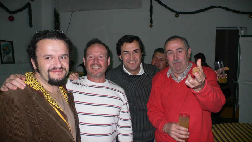 four men at a party with some drinks