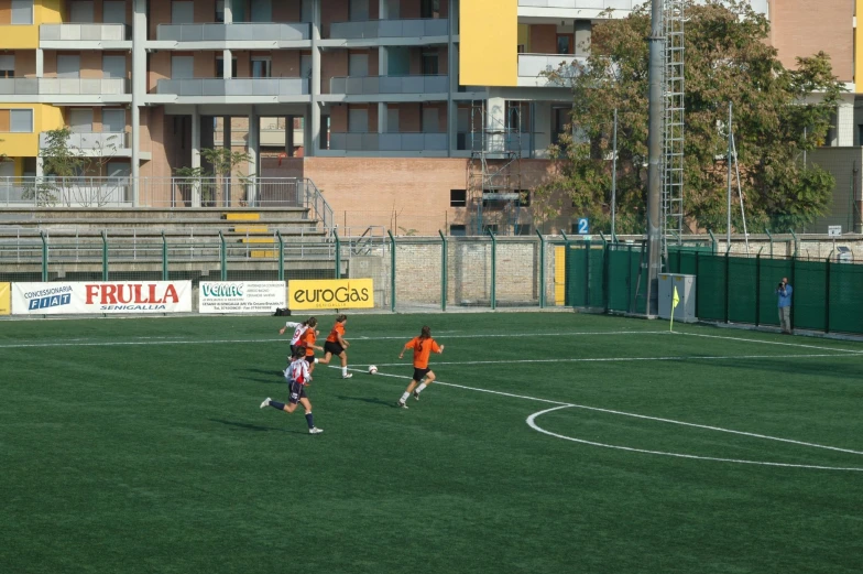 a group of young men play a game of soccer