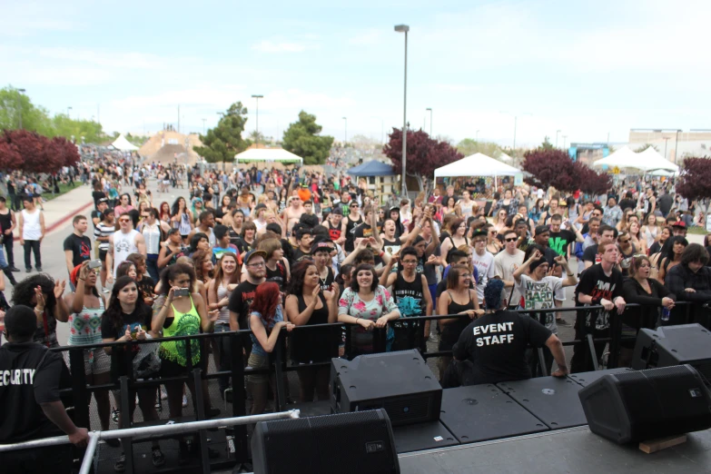 a bunch of people at a concert that is on stage