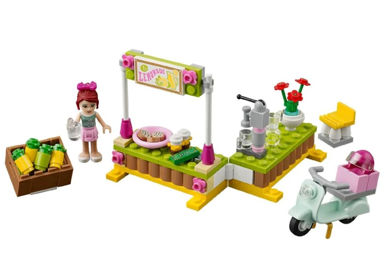two toys from lego include a woman's picnic set and a small girl's bike with accessories