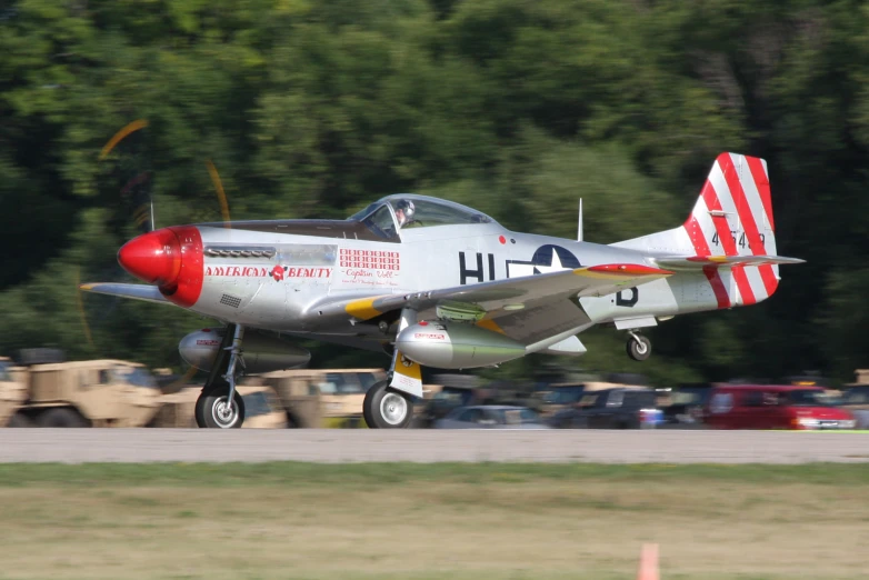 an airplane taking off from the runway at an airshow