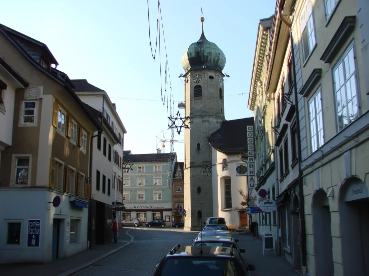 a tower with a domed top in an older european city