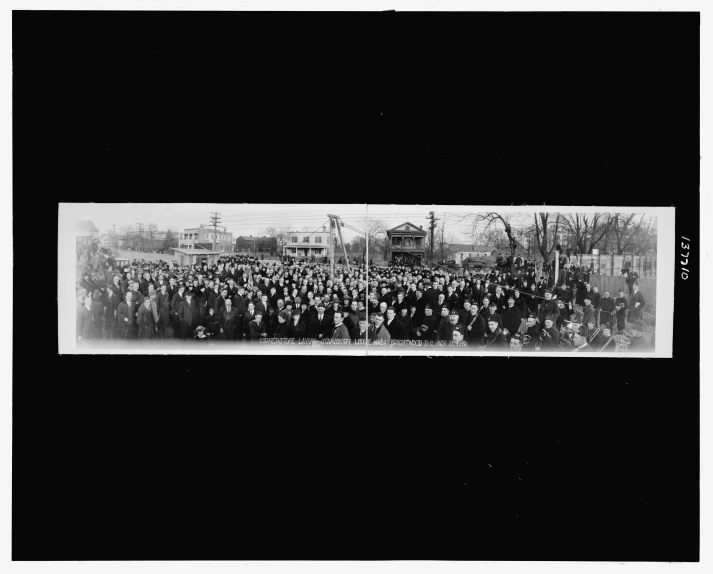 a large crowd in front of an office building