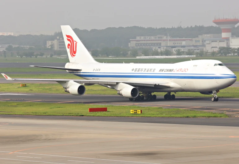 an airplane is on a runway and has a few small engines