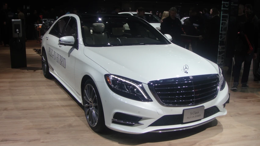 the white mercedes s - class coupe is on display