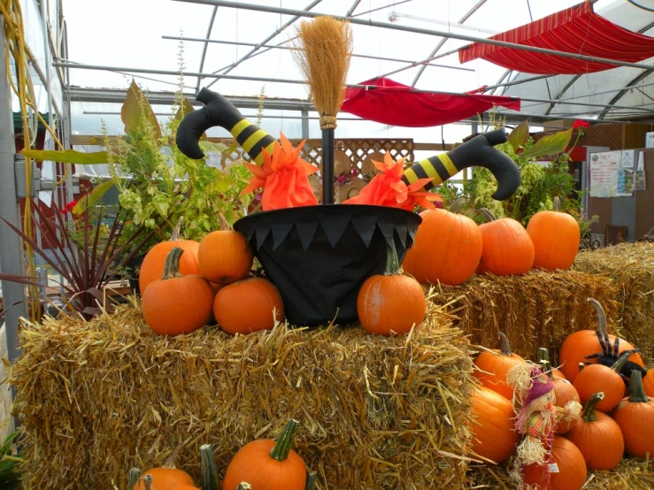 there are halloween decorations on top of hay bales