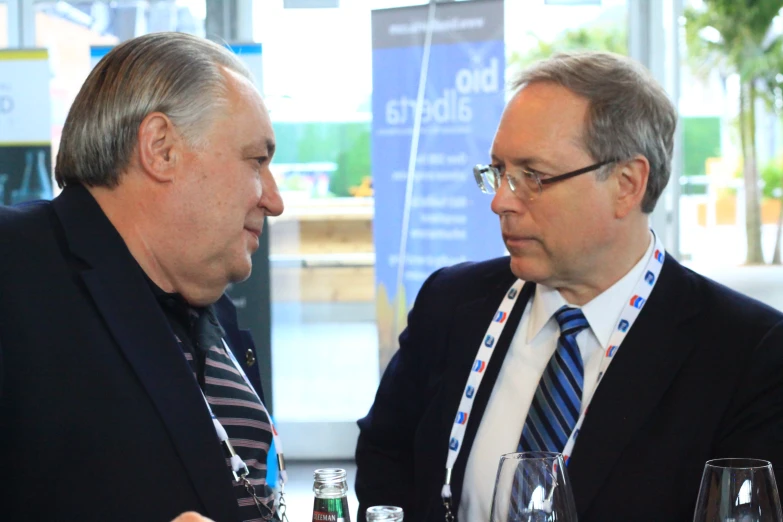 two men who are talking with each other