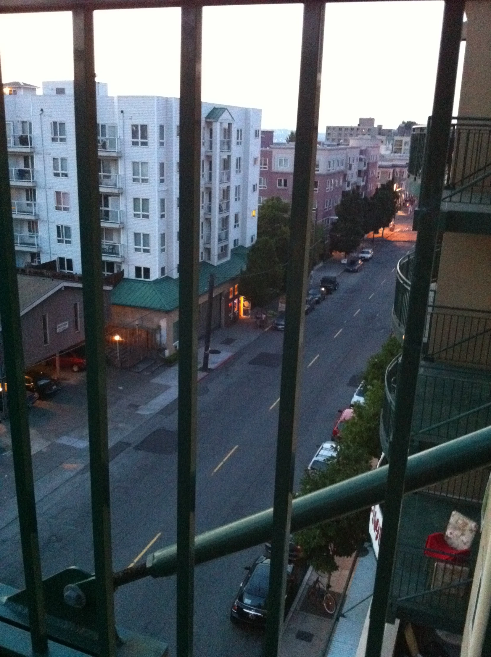 cars on a city street near buildings