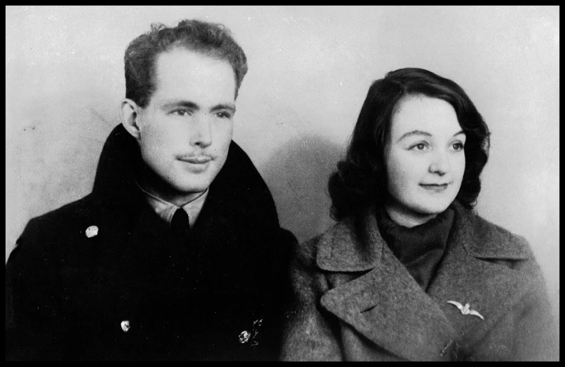 a man and woman pose for a black and white pograph