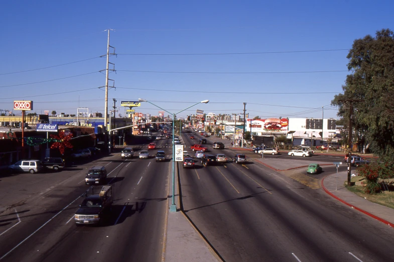 a bunch of traffic sits at a stop light on an empty road