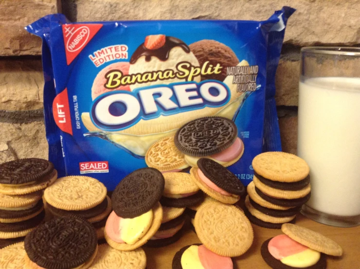 cookies and oreo cookies beside a glass of milk