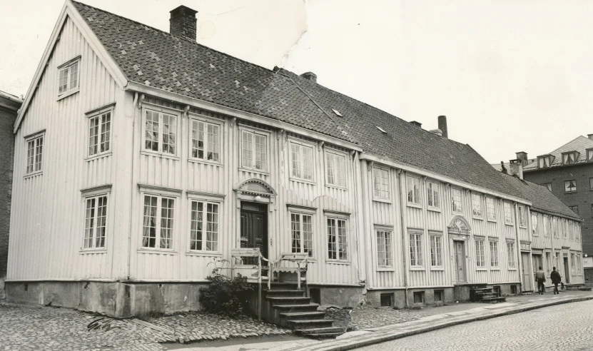 a row of white building with some steps