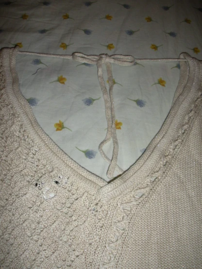a white top that has been knitted in