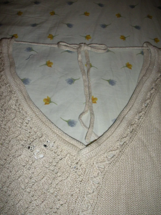 a white top that has been knitted in