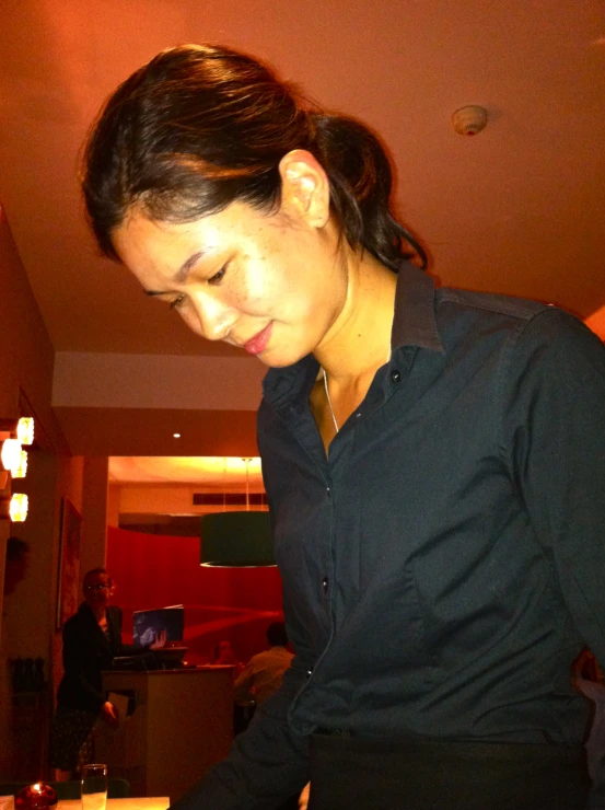 a woman preparing to cut up her cake