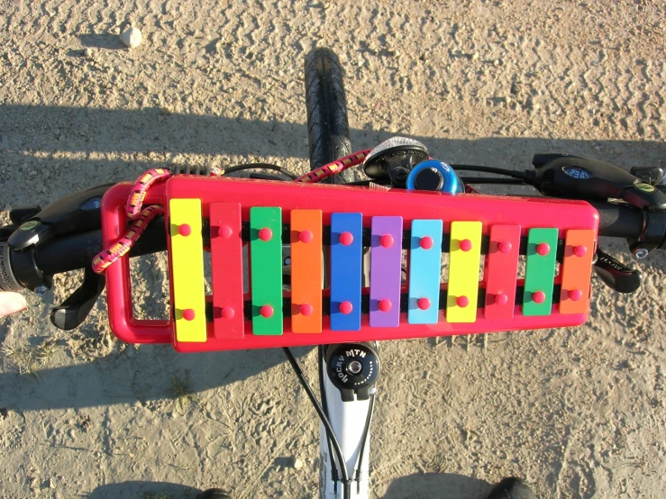 a person riding on the handlebars of a bike