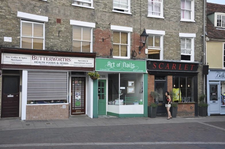 a storefront is shown on a city street