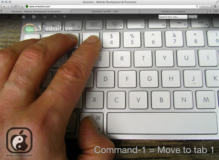 a hand that is touching the screen of a computer keyboard