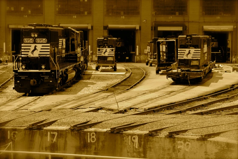 two small railroad engines that are sitting on tracks