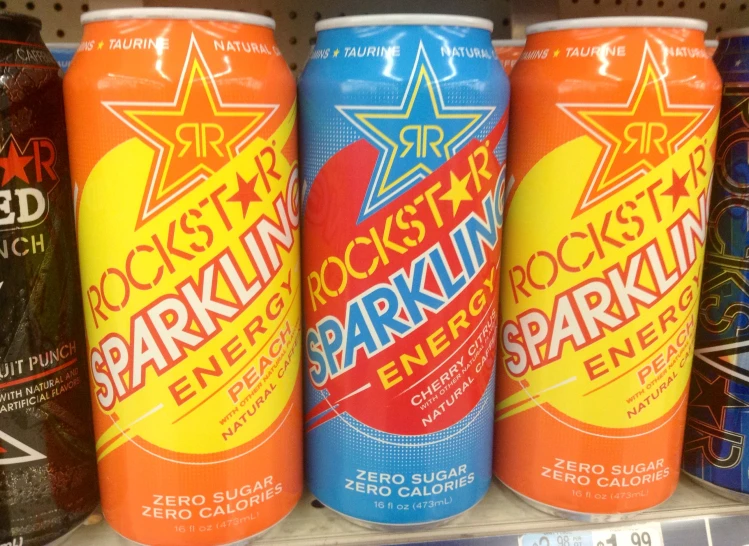 several cans of sparkling fire sparkle are in a store