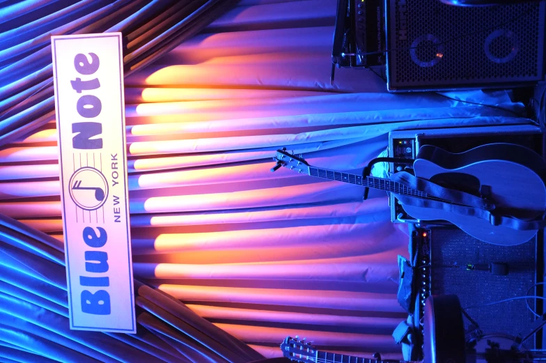 blue note is displayed on stage with blue lighting