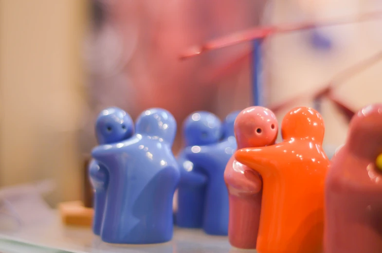 a group of ceramic figures sitting on top of a table