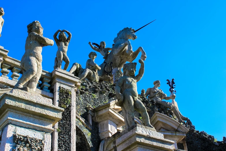 statues line the sides of a wall