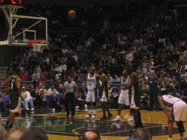 a game of basketball being played by the team