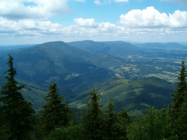 the view of some very green mountains from above