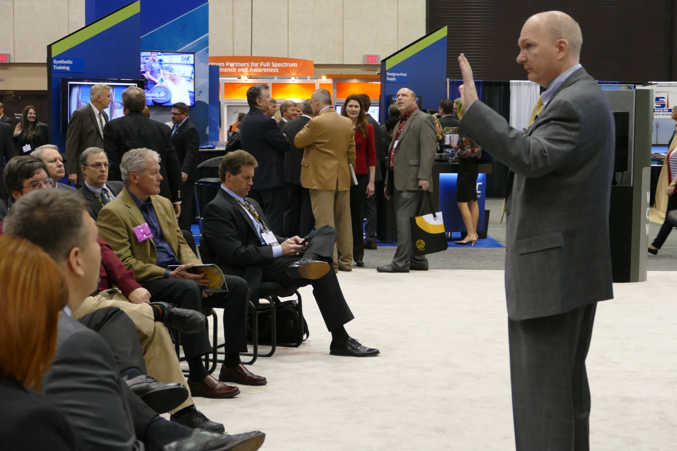 a man standing in front of a crowd with an audience