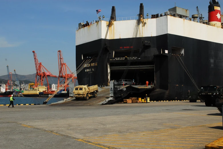 the large boat is docked on the pier