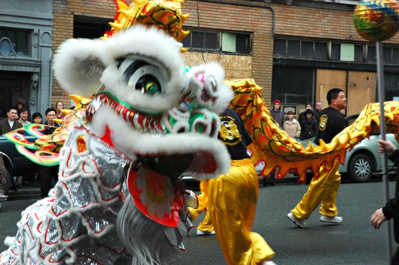 a dragon dancer doing tricks in front of people