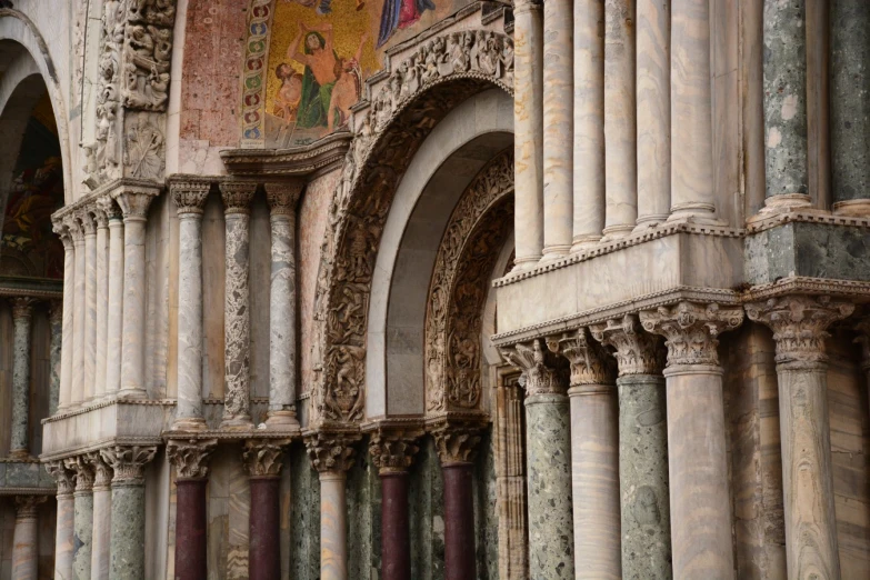 the interior of an old cathedral with statues and stained glass windows