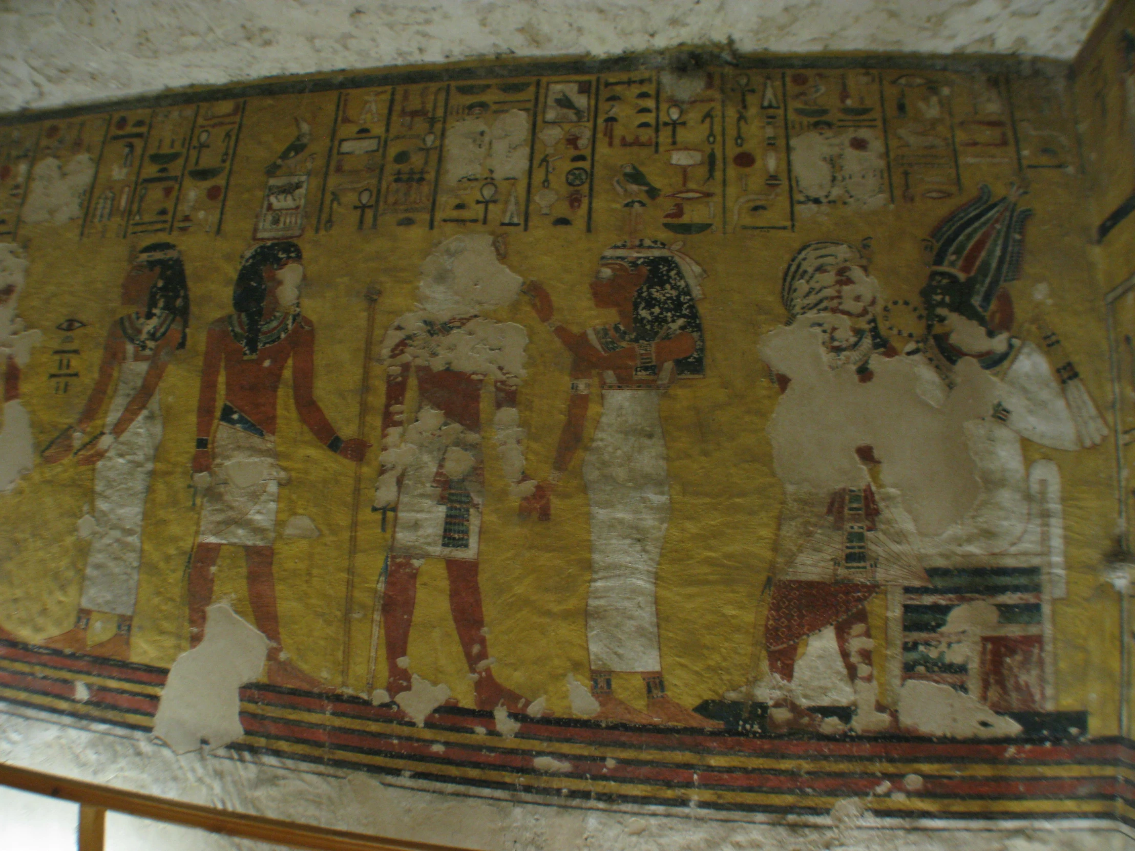 an egyptian scene depicts men, women and horses