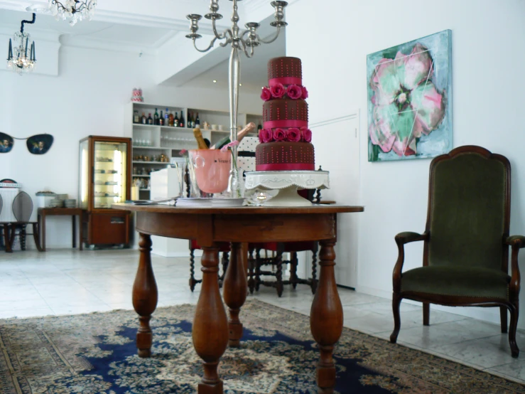 a living room with a table covered in pink cakes