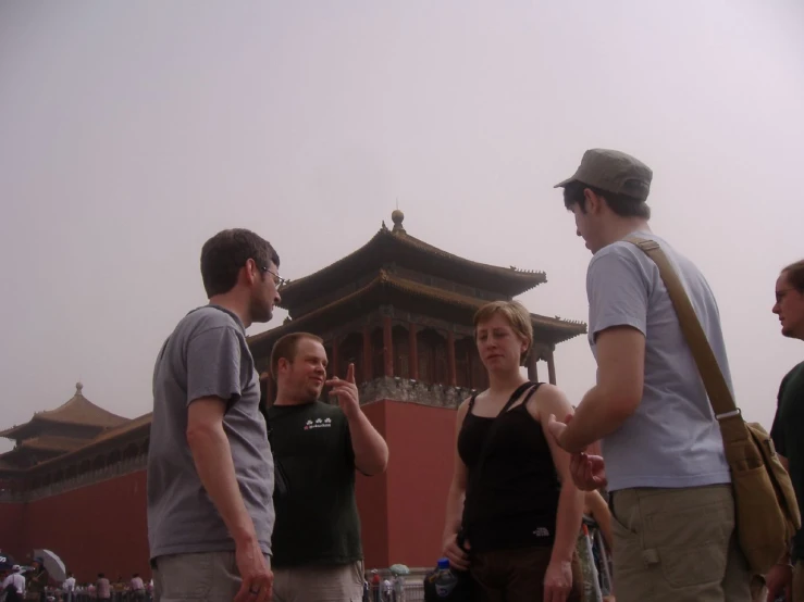 a group of people standing in front of a building