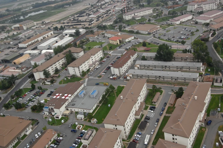 a aerial view of a parking lot and large buildings