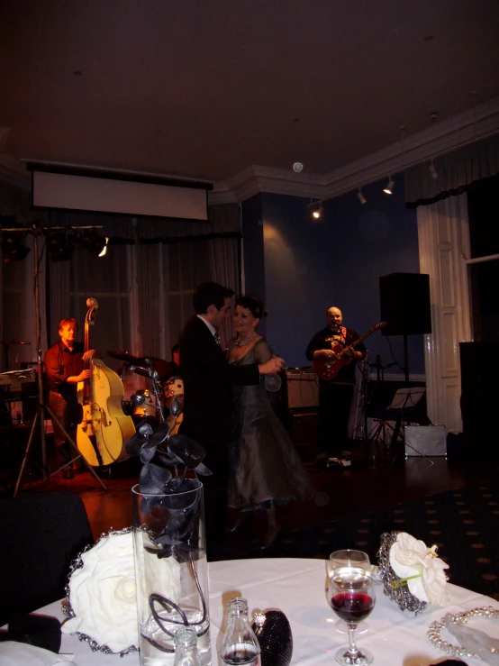 the bride and groom have their wedding cake on the table