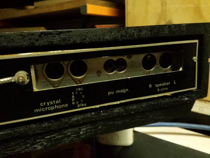 an older stereo with four microphone s in it