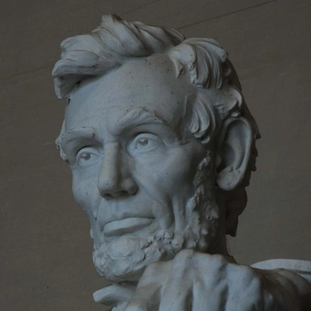 this is a close - up of the face and shoulders of an statue of aham lincoln