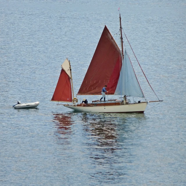 a sailboat is moving down a large body of water