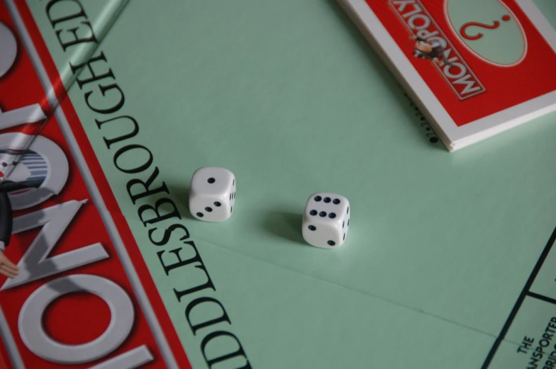 dices laying on top of a green card board