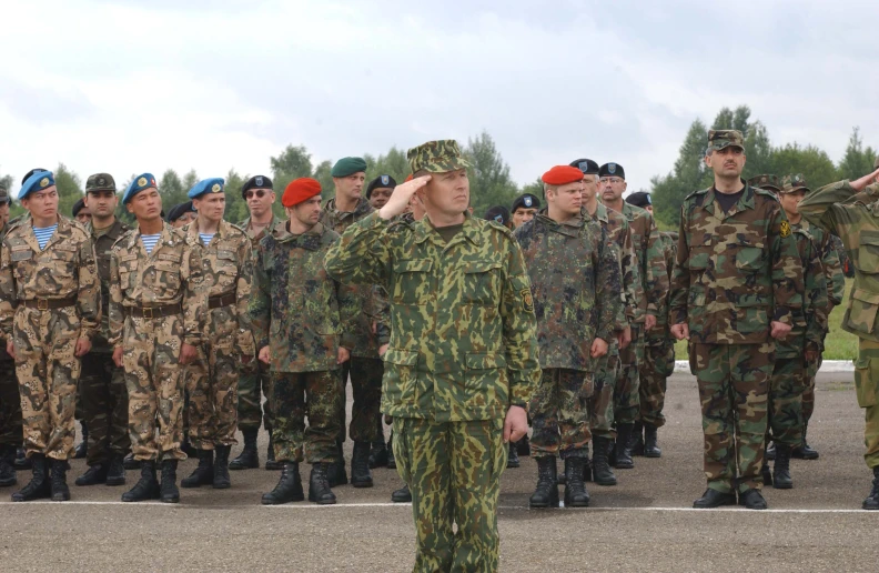 a group of soldiers in green camouflage uniforms