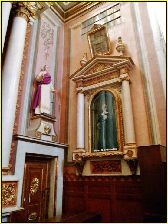 a gold alter in the interior of a building