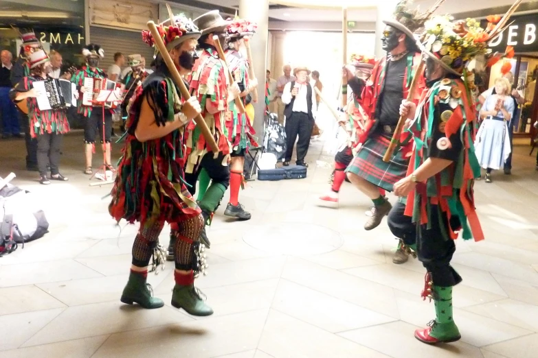 several people dressed in colorful costumes and hats